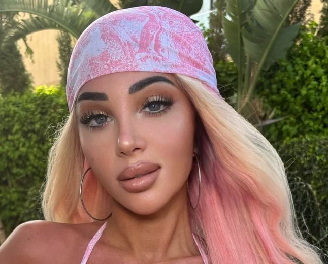 Tulisa debuts new pink and blonde locks as she sizzles in skimpy bikini after returning to the stage following Bell's palsy attack