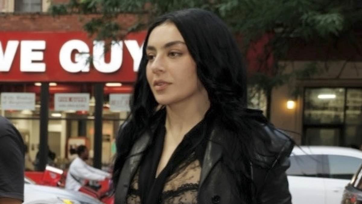 Charli XCX turns heads as she flashes her bra in a sheer lace top while leaving her album listening party in New York City