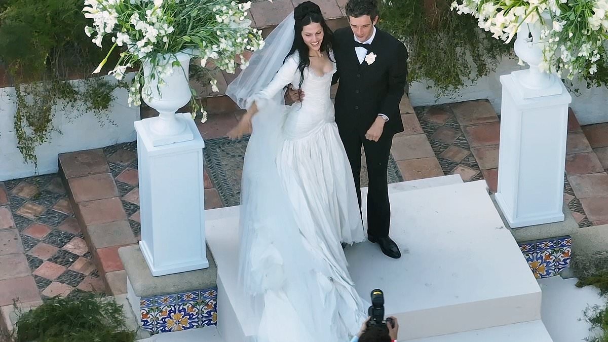 Gabbriette Bechtel reveals her wedding dress was made by avant-garde celebrity fashion label Matières Fécales after she tied the knot with The 1975 frontman Matty Healy