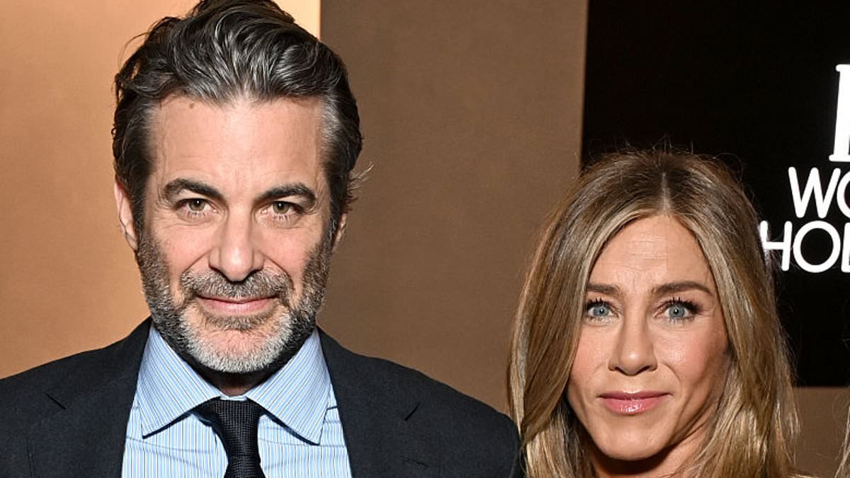 Jennifer Aniston proves she and hypnotherapist boyfriend Jim Curtis are still going strong after rumors of 'tension' in romance