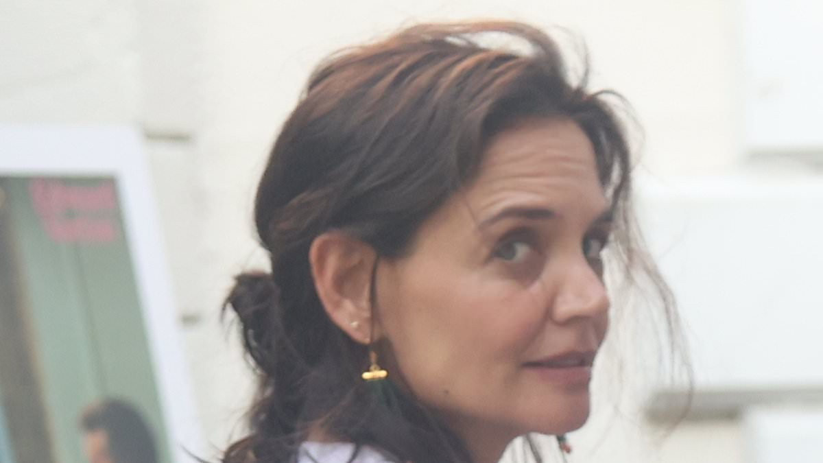 Does Katie Holmes have a toyboy? Tom Cruise's ex, 47, holds hands with hunky artist nearly 10 years her junior in the Hamptons