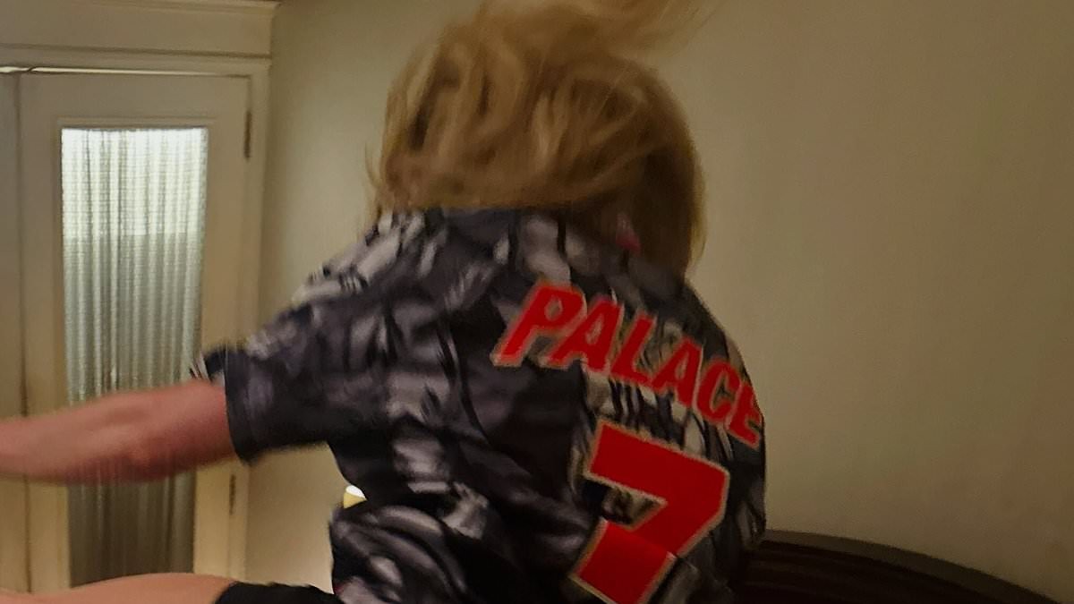 Ellie Goulding celebrates in a football shirt as she reveals she will perform at halftime during the England vs Norway World Cup match