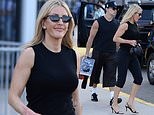 Ellie Goulding, 39, and boyfriend Beau Minniear, 29, display their muscular arms in matching tank tops as they leave the World Cup final