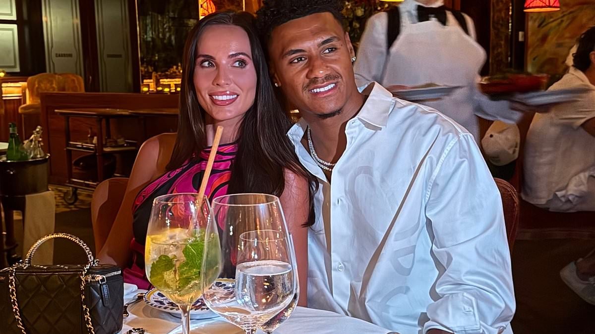 WAG Ellie Watkins looks glamorous in a pink satin top as she enjoys dinner with husband Ollie to celebrate the end of the World Cup