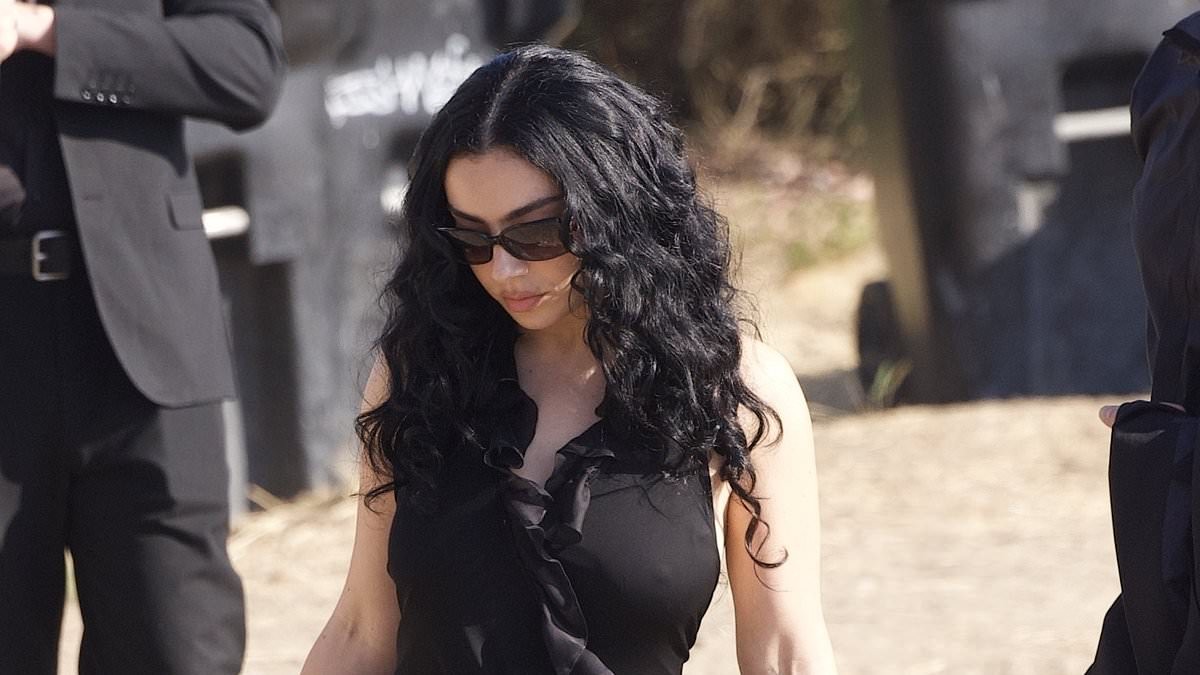 Taylor Swift's frenemy Charli XCX puts on a leggy display in a black gown as she attends singer's ex Matty Healy's wedding to Gabbriette Bechtel