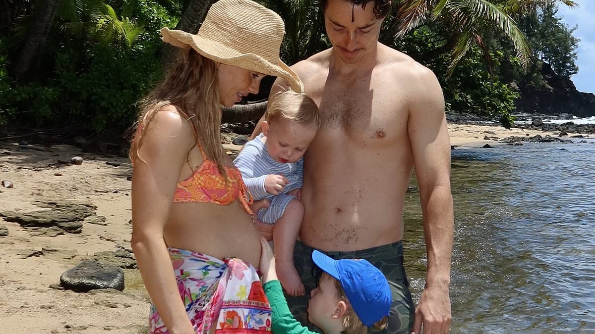 DJ Tigerlily shows off her baby bump in skimpy bikini in Hawaii as she announces she's expecting third child just one year after welcoming son