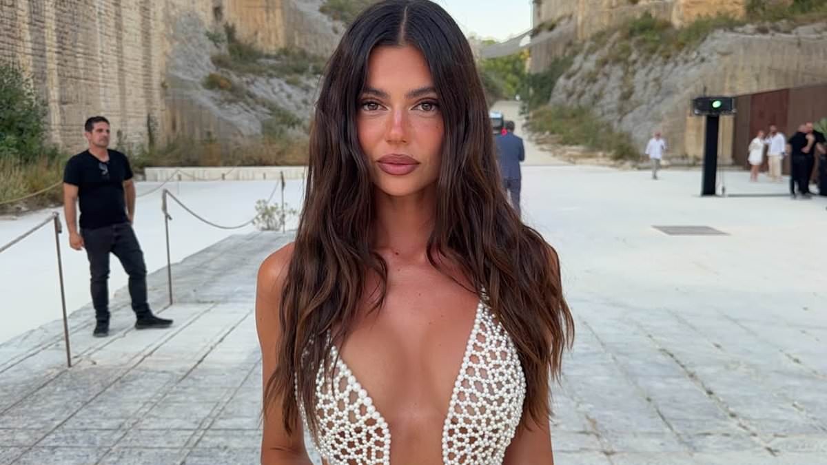 Aussie influencer reveals her G-string tan line as she wears a completely see-through dress made out of just pearls to an event in Sicily