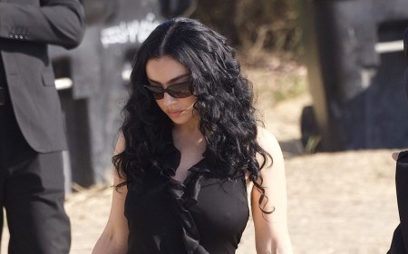 Taylor Swift's frenemy Charli XCX puts on a leggy display in a black gown as she attends singer's ex Matty Healy's wedding to Gabbriette Bechtel