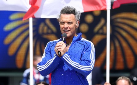 Robbie Williams sparks hilarious comparisons to Paulie from The Sopranos as he wears a sparkly blue tracksuit for World Cup Final show