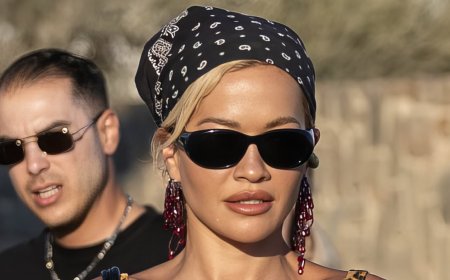 Rita Ora teams her leopard print bikini with teetering heels as she shows off her jaw-dropping abs on a night out with her pals in Mykonos