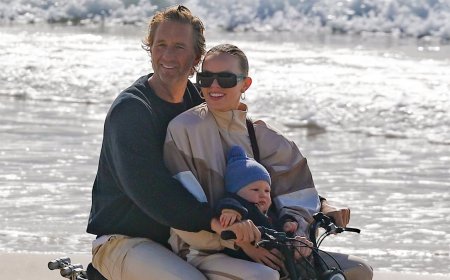 Billionaire Justin Hemmes seen riding an e-bike with his partner Madeline Holtznagel and their one-year-old son all without helmets in Byron Bay