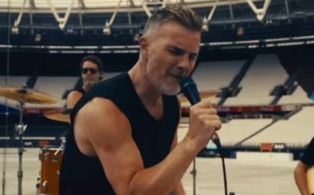 Gary Barlow, 55, sends fans wild with his incredible glow up as he shows off his bulging biceps in a vest after checking into £6.5k wellness clinic to prepare for Take That's Circus Tour