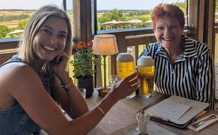 Holly Valance enjoys a drink with Pauline Hanson at Jeremy Clarkson's pub in England after endorsing far-Right Australian party One Nation's leader: 'Nothing like a beer with your mate at the pub on a hot day'