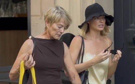 Margot Robbie looks chic in a yellow silk co-ord as she joins her mother Sarie Kessler on a girls' trip to Paris