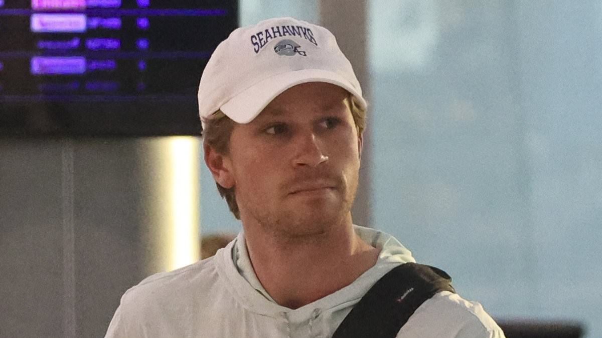 Robert Irwin plays coy on his relationship status as he rocks a casual look while strolling through Sydney Airport