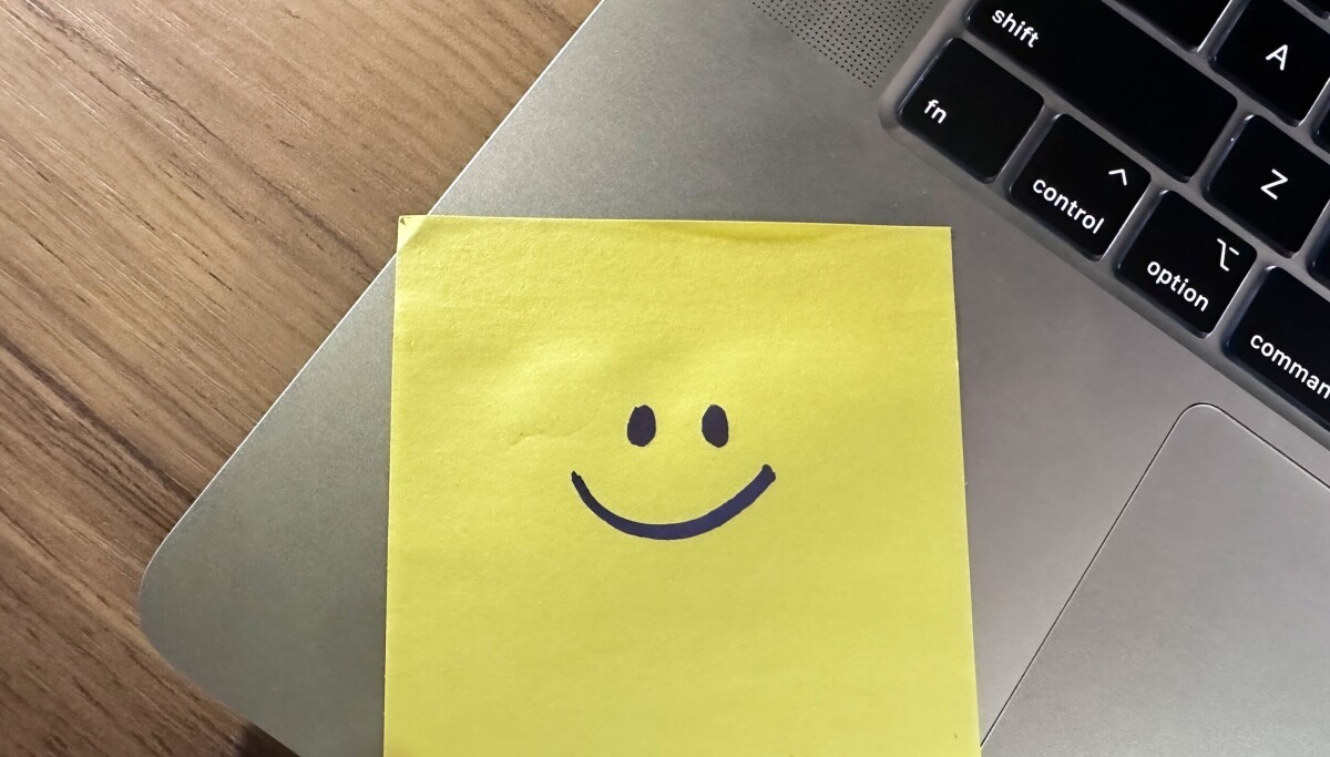 IT department put sticky notes on the laptops to help employees log in