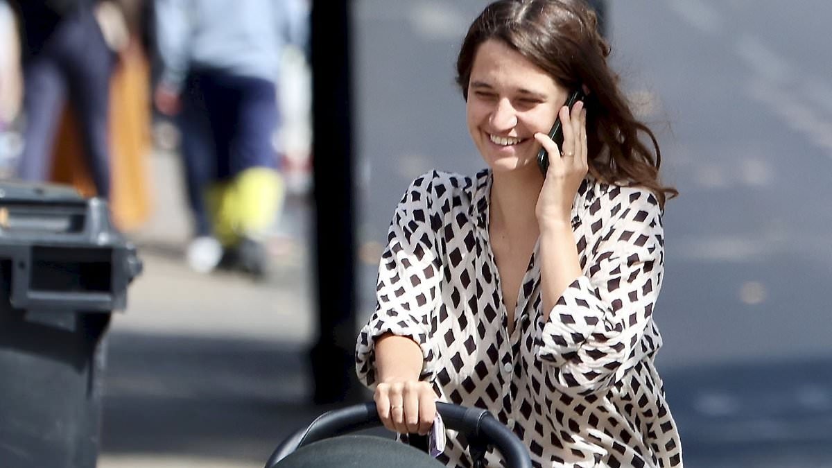 A new sensation! Michael Hutchence's daughter Tiger Lily is a natural at motherhood as she takes her baby out for a stroll in a pram and flashes her wedding band from husband Ben Archer