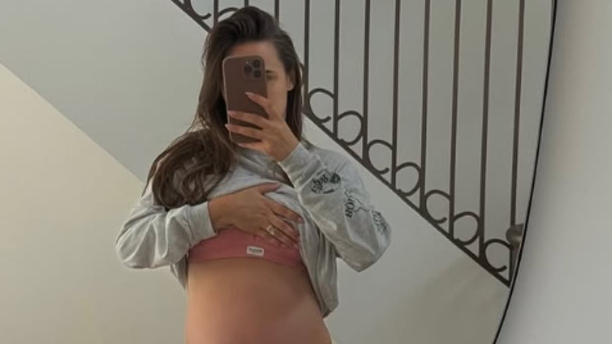 Pregnant Lucy Watson jokes 'there is simply no more room' as she shows off her baby bump in a sports bra while counting down to her due date