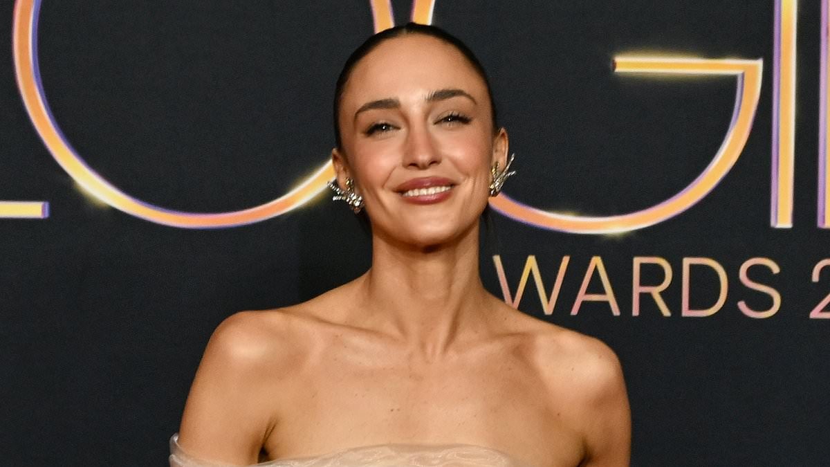 Abbey Gelmi flaunts her trim physique and toned tummy in a tulle bandeau top and see-through skirt at the 2026 Logie Awards in Sydney