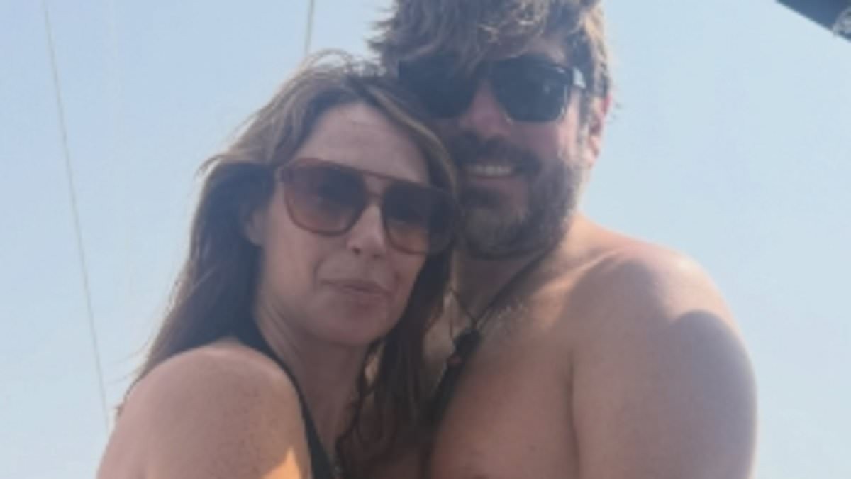 The One Show host Alex Jones cuddles shirtless husband Charlie Thomson as she opens up her holiday photo album from family sailing trip