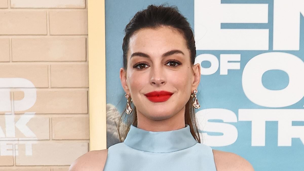 Anne Hathaway, 43, roasted over 'ridiculous' maternity outfit as she shows off baby bump at LA premiere