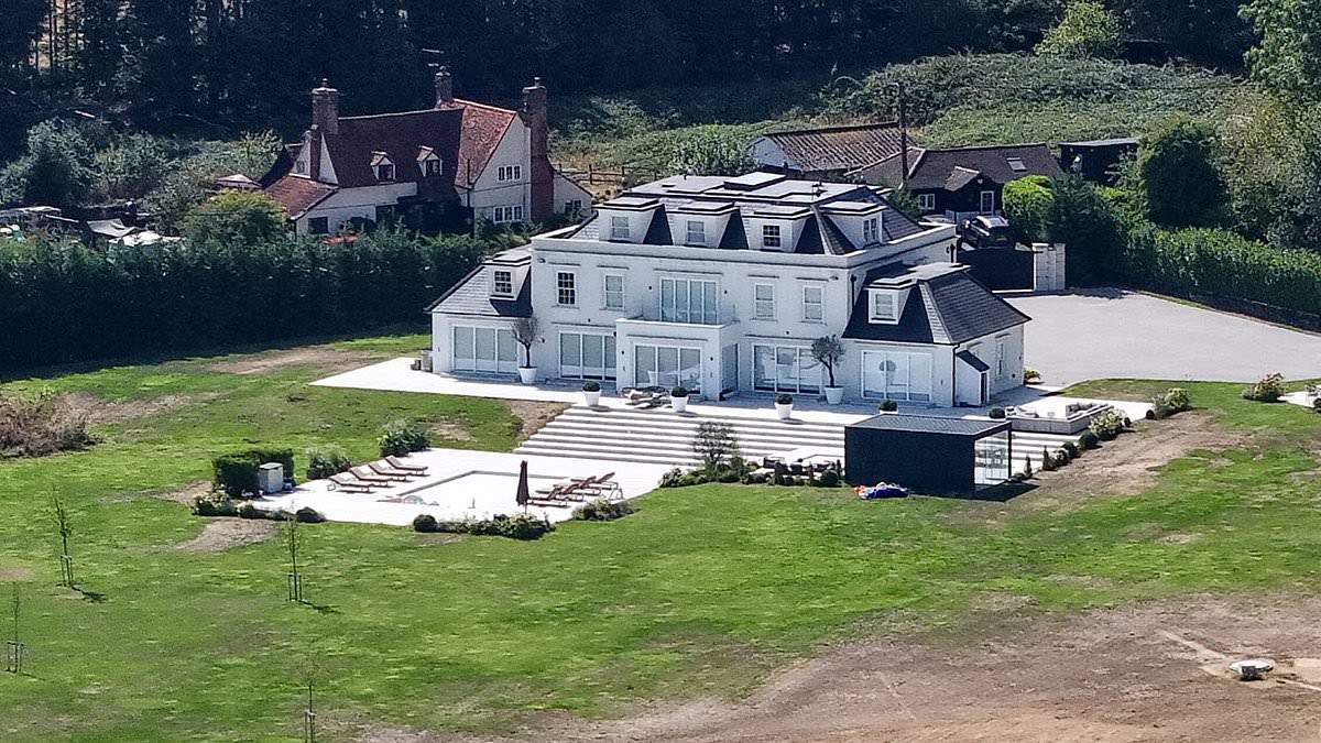 Mark Wright and Michelle Keegan's VERY green grass stands out next to the dry surroundings during record-breaking drought