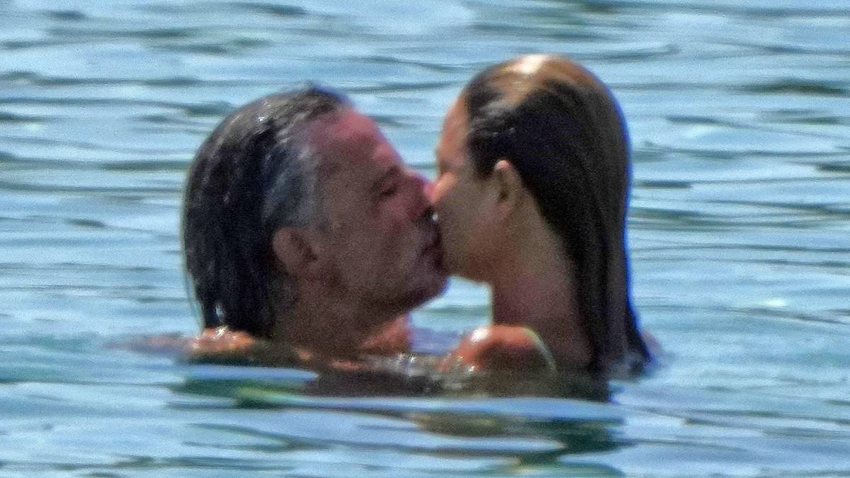 Bikini-clad Dina Broadhurst, 50, confirms new age-appropriate romance with wealthy German artist, 48, as they kiss at the beach in Ibiza after her split from toyboy lover Danny Tchalaby
