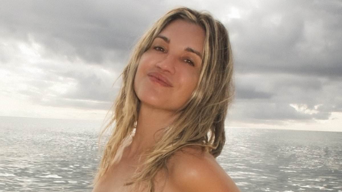 Ashley Roberts, 44, goes topless on the beach before slipping into a black bikini on Barbados getaway with her boyfriend George Rollinson, 26