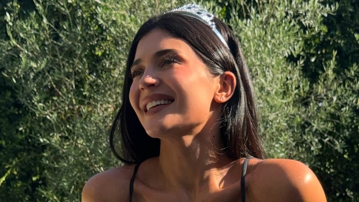 Kylie Jenner strips down to tiny bikini and tiara after being trolled over her 'indecent' dress at pal Jordyn Woods's wedding