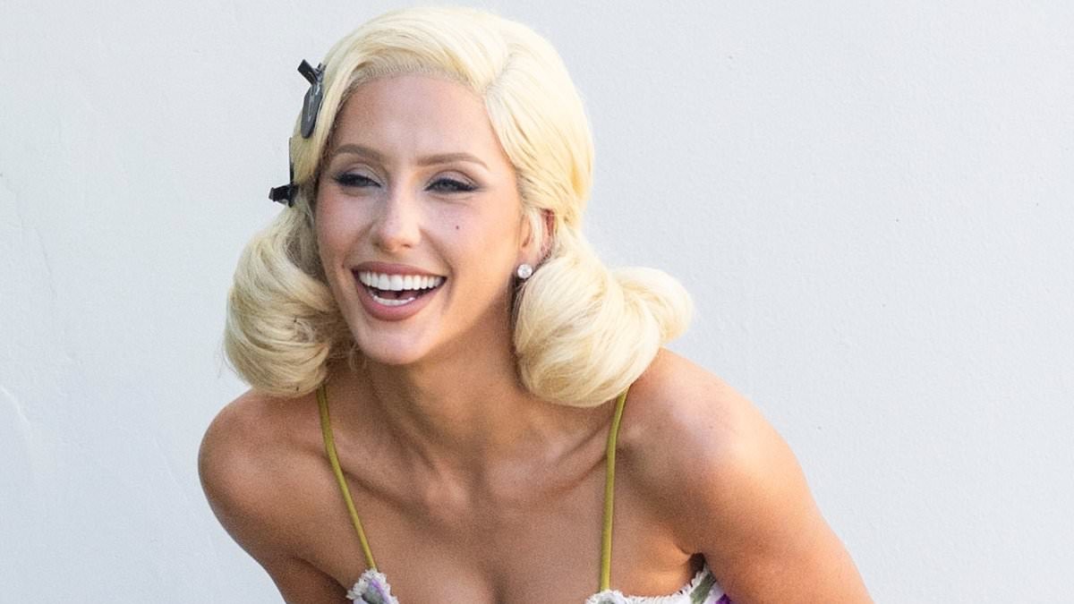 Alix Earle puffs on a cigarette in platinum blonde wig and tiny mini dress during pinup photo shoot