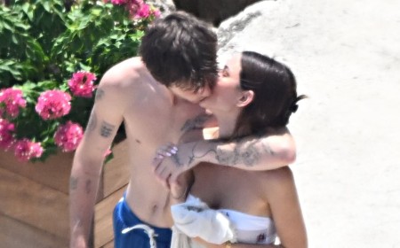 Cruz Beckham, 21, plants a passionate kiss on his bikini-clad girlfriend Jackie Apostel, 30, as they soak up the sun during family trip to the Amalfi Coast