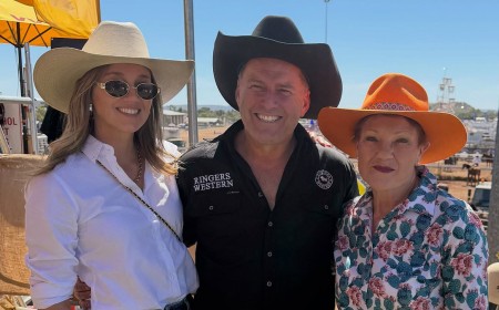 Karl Stefanovic divides fans as he poses with his wife Jasmine and Pauline Hanson at the Mount Isa Rodeo and calls them 'the luckiest girls in the world'