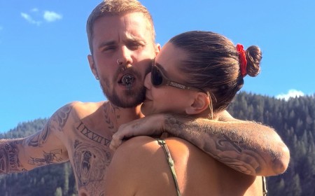 Shirtless Justin Bieber shares a rare PDA with bikini-clad Hailey as they enjoy a boat day with friends