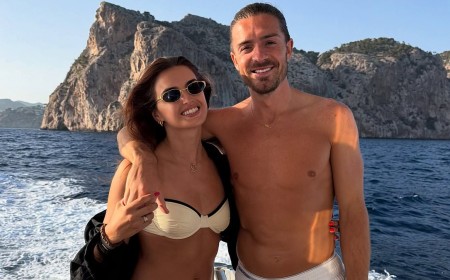 Sasha Attwood stuns in a white bikini as she cuddles shirtless Jack Grealish as they enjoy a glamorous boat day date ahead of the football season