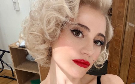 Pixie Lott has a 'Marilyn Monroe' moment with blonde curls and red lipstick as she poses in a lace bra