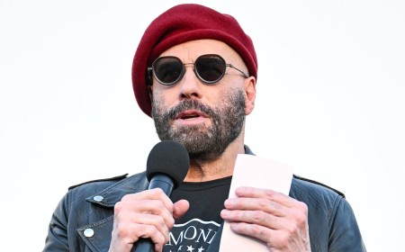 John Travolta rocks ANOTHER beret at Ramones 50th anniversary tribute... after fans mercilessly roasted his 'kooky' style