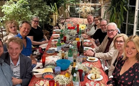 Richard E Grant reveals he 'edited' friends out of his life after the death of his wife as he shares 'iconic' snap of his A-list dinner party guests