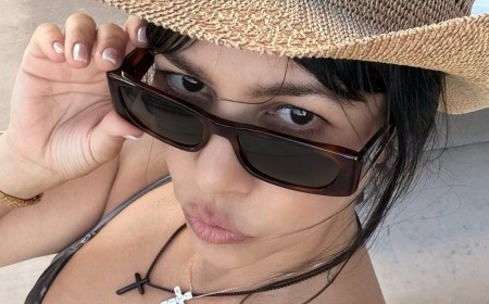 Kourtney Kardashian, 47, models skimpy silver bikini on family vacation with husband Travis Barker and kids