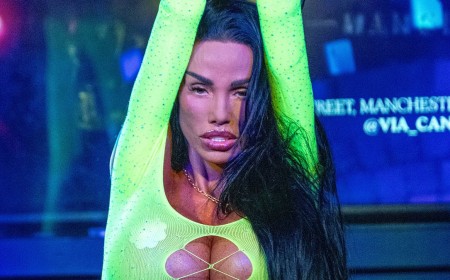 Katie Price lets her hair down as she performs her hit I Got U in very racy cut-out neon leotard at Manchester Pride