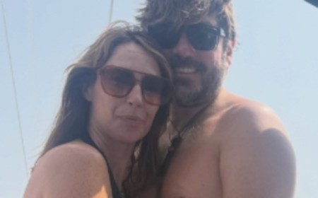The One Show host Alex Jones cuddles shirtless husband Charlie Thomson as she opens up her holiday photo album from family sailing trip