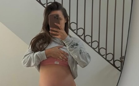 Pregnant Lucy Watson jokes 'there is simply no more room' as she shows off her baby bump in a sports bra while counting down to her due date