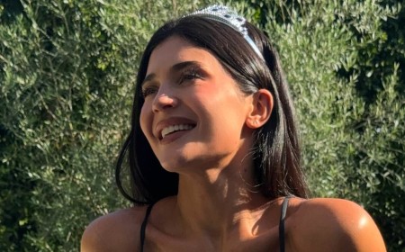 Kylie Jenner strips down to tiny bikini and tiara after being trolled over her 'indecent' dress at pal Jordyn Woods's wedding
