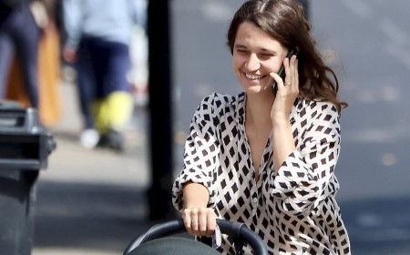 A new sensation! Michael Hutchence's daughter Tiger Lily is a natural at motherhood as she takes her baby out for a stroll in a pram and flashes her wedding band from husband Ben Archer