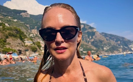Heather Graham, 56, showcases her incredible figure in a maroon bikini as she frolics in the sea during sun-soaked Italian getaway
