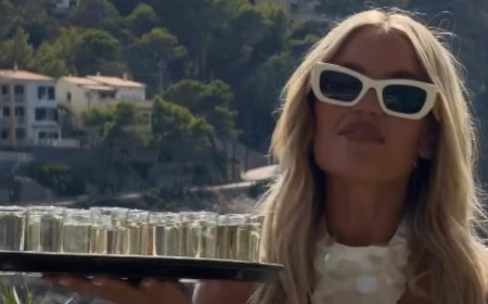 Love Island's Molly Smith carries a tray of shots and shares videos of her boozy wedding party after police were called to day two of her raucous celebrations with Tom Clare