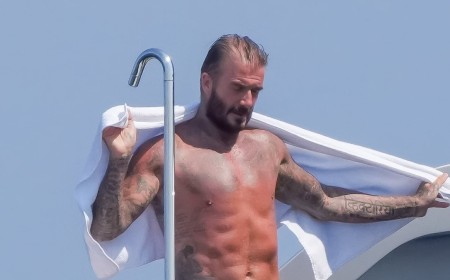 David Beckham shows off his sexy side as he towels off after a shower on board luxury superyacht in the South of France