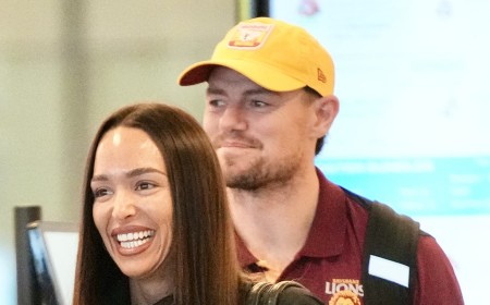 AFL star Lachie Neale steps out with rumoured new girlfriend Emma Field as pair arrive together in Brisbane after Melbourne trip - as estranged wife Jules rebuilds her life