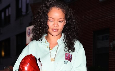 Rihanna is every inch the doting mother as she clutches a Spider-Man balloon while she and A$AP Rocky take their sons RZA and Riot to the dentist