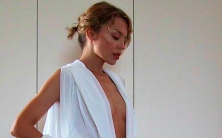 Kylie Minogue, 58, shares throwback snaps in her iconic Can't Get You Out Of My Head jumpsuit 25 years on as it reaches a billion streams on Spotify