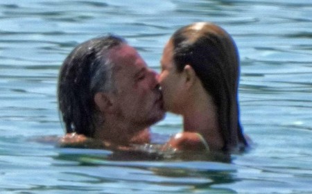 Bikini-clad Dina Broadhurst, 50, confirms new age-appropriate romance with wealthy German artist, 48, as they kiss at the beach in Ibiza after her split from toyboy lover Danny Tchalaby